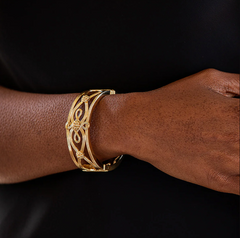 Gold Monique Hinged Bangle from Capucine De Wulf. 